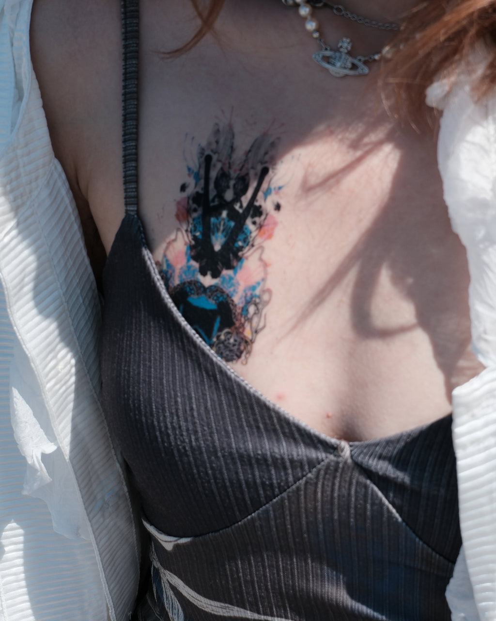 Order & Disorder #6 temporary tattoo(small) worn on the chest, modeled by the artist Fangzi Luo